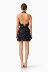 Brunette model wearing Cherry Blossom Mini Dress in Black back shot