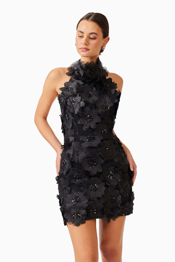 Brunette model wearing Cherry Blossom Mini Dress in Black close up shot