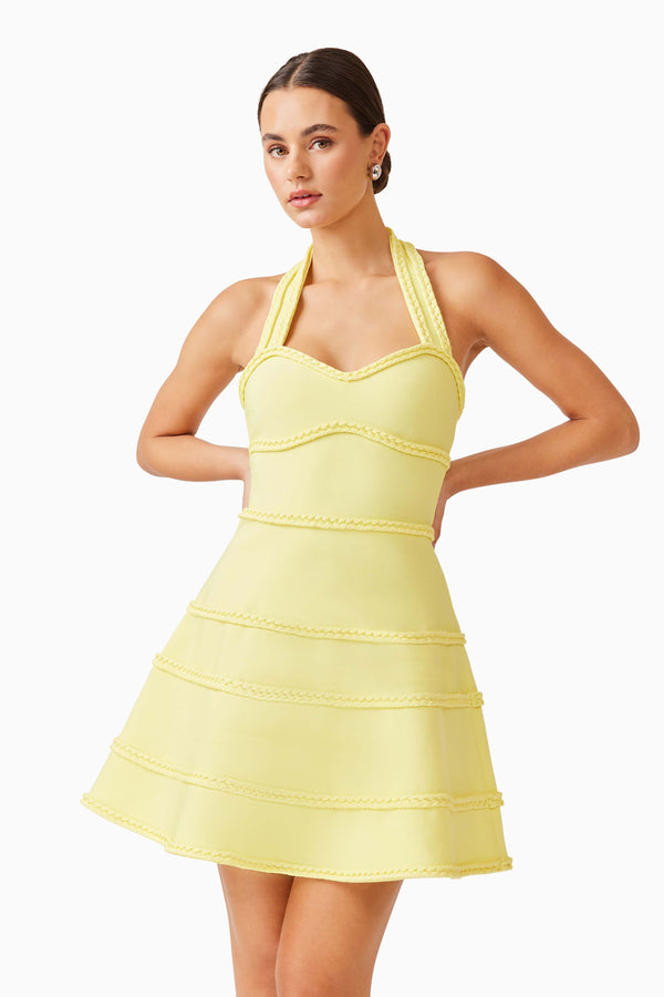 Brunette model wearing Katlyn Halter Mini Dress in Yellow close up posed shot