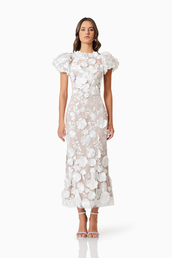 Brunette model wearing Astraea 3D Lace Maxi Dress In White front shot