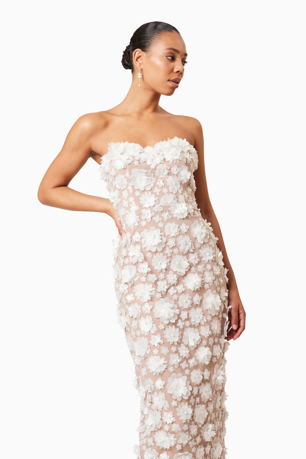 Brunette model wearing Bluebell 3D Midi Dress in White close up shot