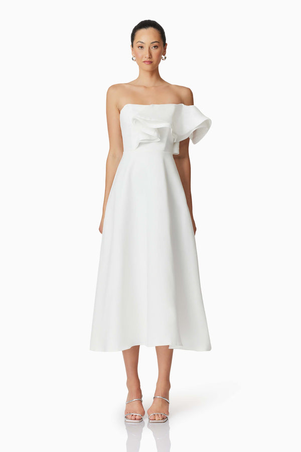 Brunette model wearing Celia Asymmetrical Midi Dress in White front shot