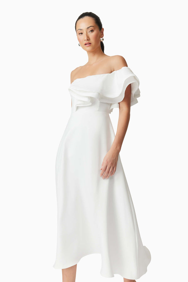 Brunette model wearing Celia Asymmetrical Midi Dress in White close up shot