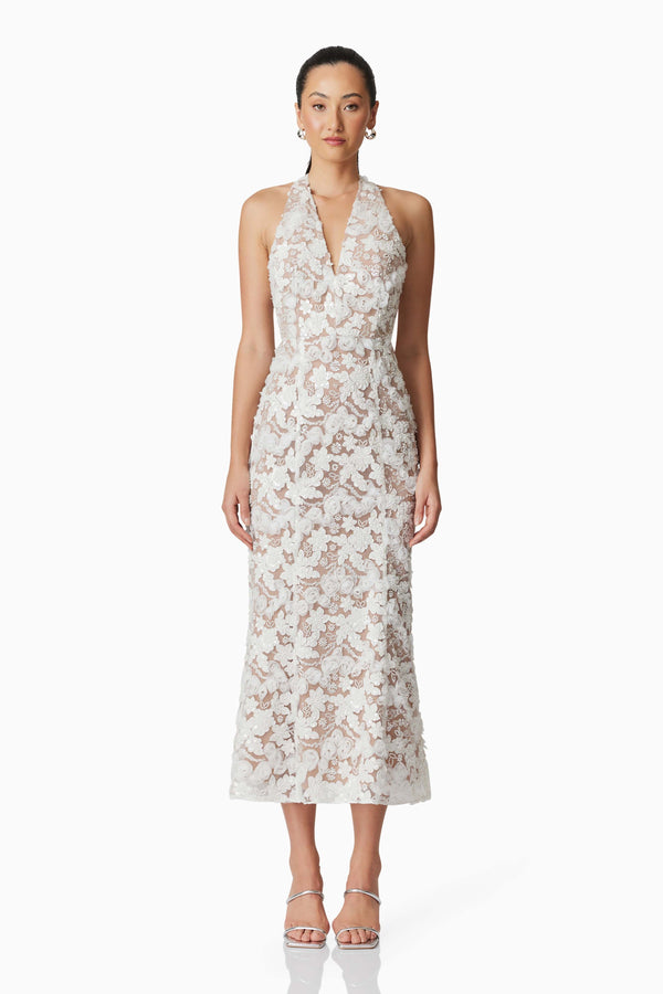 Brunette model wearing Vonni Halter Maxi Dress in White front shot