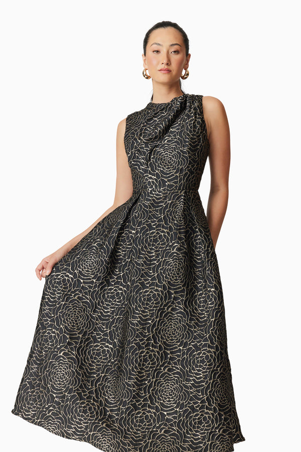 Brunette model wearing Deanna Midi Dress in Black posed shot
