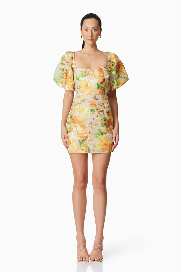Brunette model wearing Aella Puff Sleeve Mini Dress in Yellow front shot