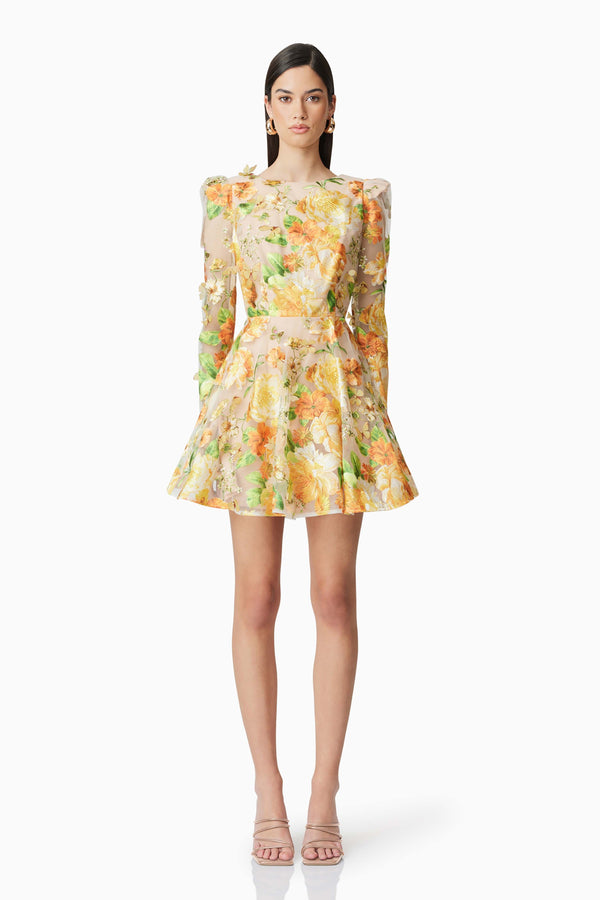 Brunette model wearing Aella A-Line Mini Dress in Yellow front shot