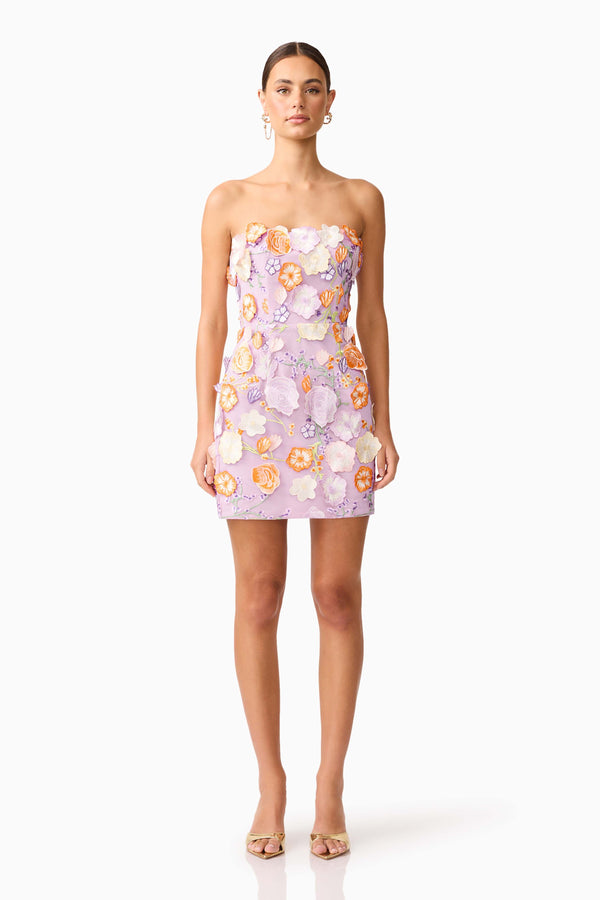 Brunette model wearing Arabella Strapless Floral Mini Dress in Orange & Purple front shot
